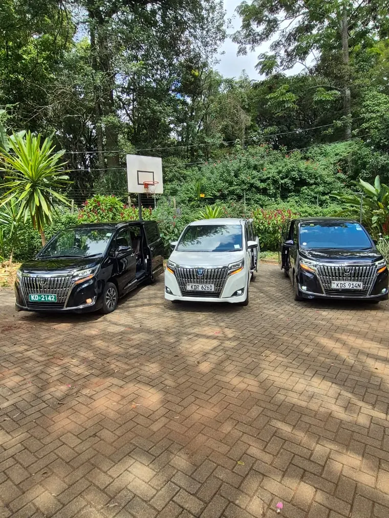 Three vans parked side by side, ready for a group trip